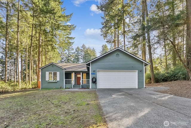 single story home featuring a garage, driveway, and a front lawn