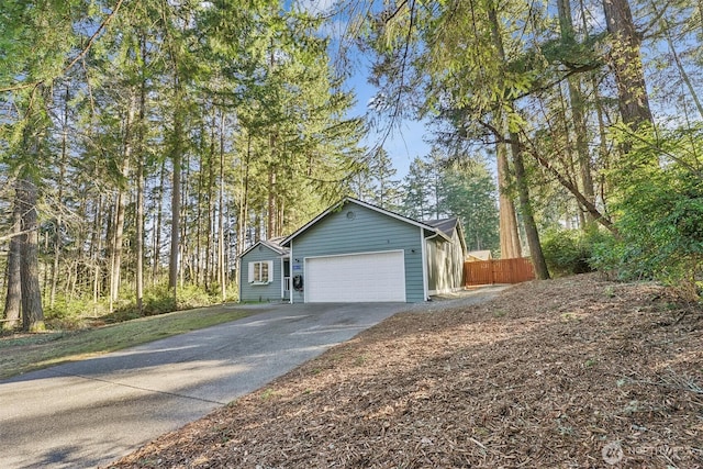 exterior space with a garage and concrete driveway