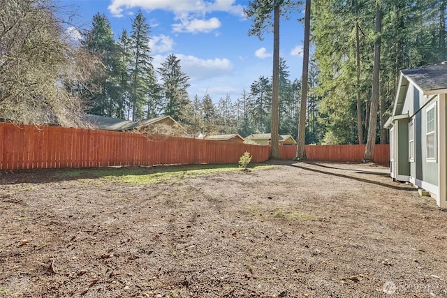 view of yard with a fenced backyard