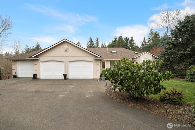 single story home featuring a garage