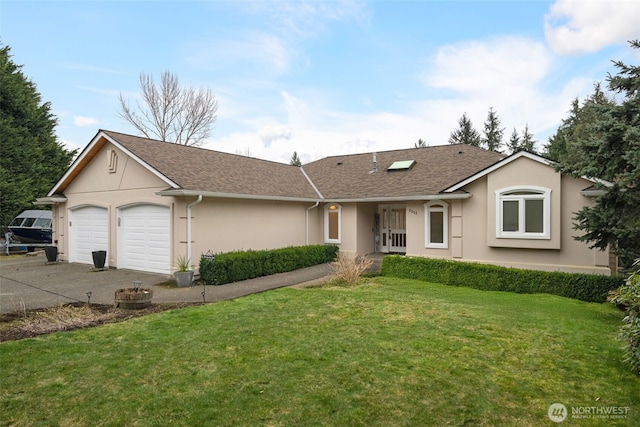 ranch-style house featuring a garage and a front lawn