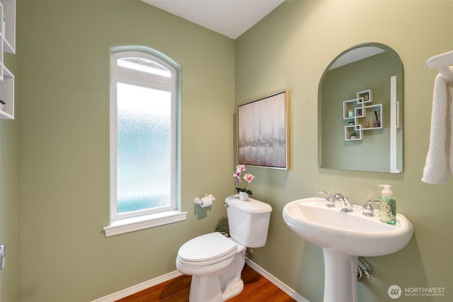 bathroom featuring sink, toilet, and hardwood / wood-style floors