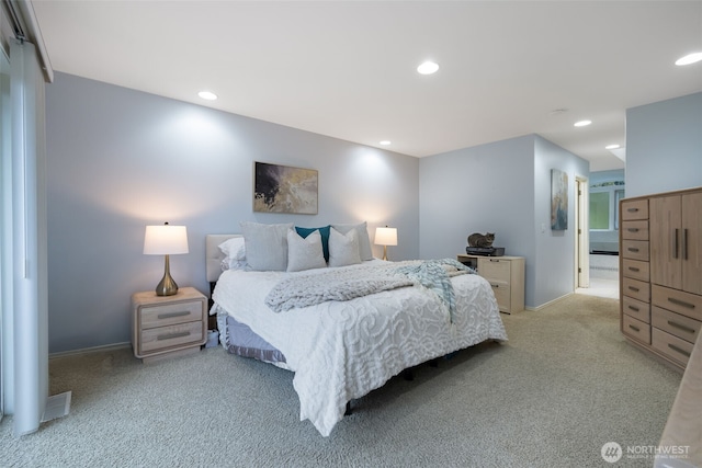 bedroom featuring light carpet