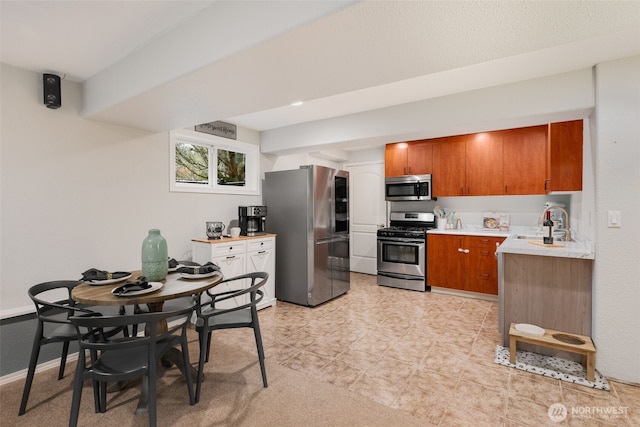 kitchen featuring stainless steel appliances and sink