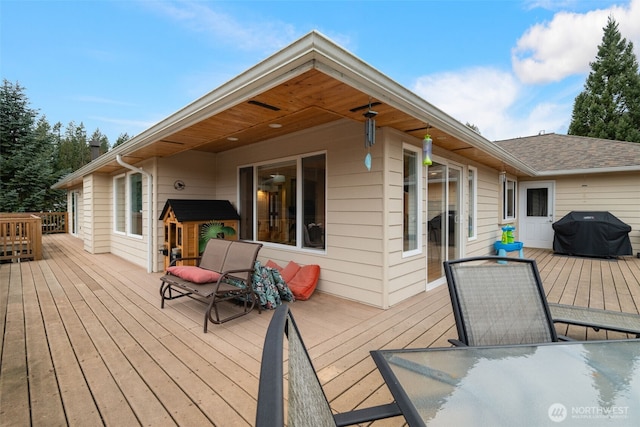 wooden terrace featuring grilling area