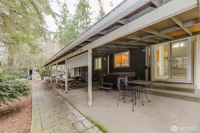 view of patio / terrace featuring a hot tub