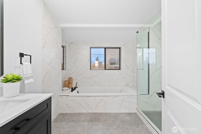 bathroom with vanity and independent shower and bath