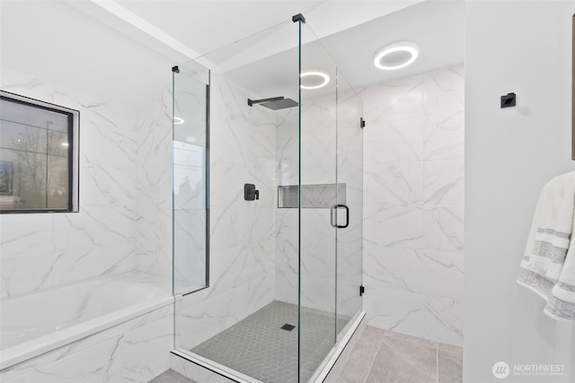 bathroom with separate shower and tub