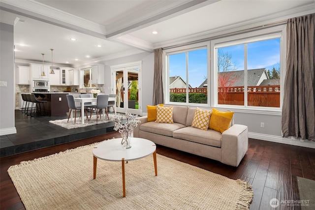 living room featuring dark wood finished floors, recessed lighting, ornamental molding, beamed ceiling, and baseboards