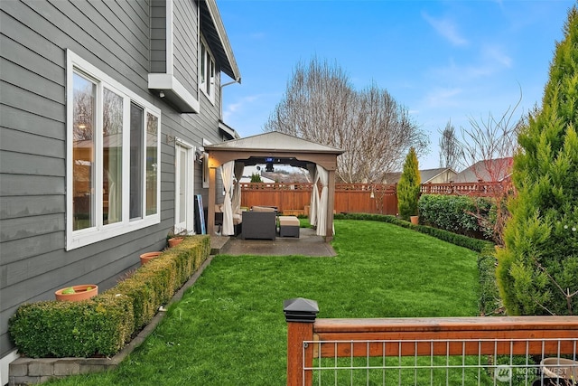 view of yard with a gazebo, a patio, a fenced backyard, and an outdoor living space