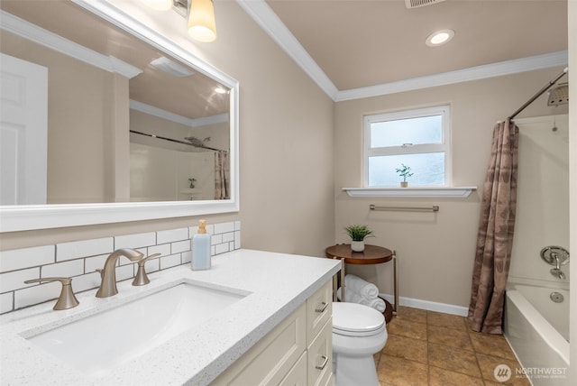 bathroom with baseboards, vanity, crown molding, and toilet