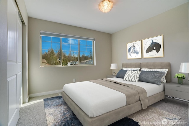 carpeted bedroom with baseboards