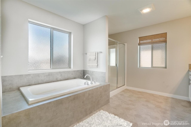 full bathroom with a garden tub, baseboards, and a stall shower