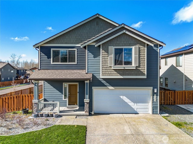 view of front of home featuring a garage, covered porch, concrete driveway, and fence