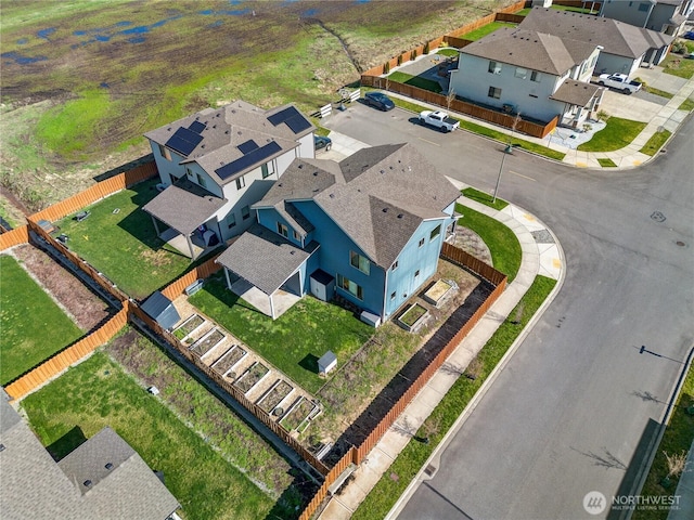 birds eye view of property with a residential view