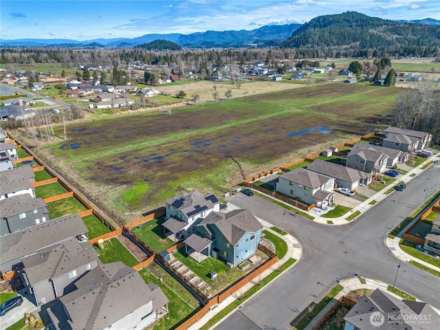 aerial view featuring a mountain view and a residential view