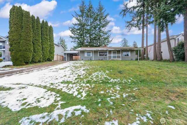 ranch-style home featuring a front yard