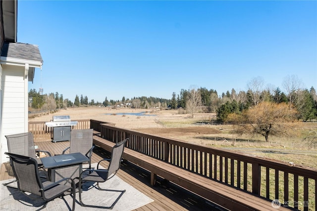 wooden deck featuring a rural view and area for grilling