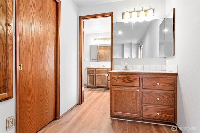 bathroom featuring vanity and wood-type flooring