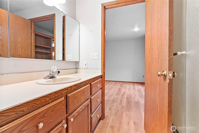 bathroom featuring vanity and hardwood / wood-style floors