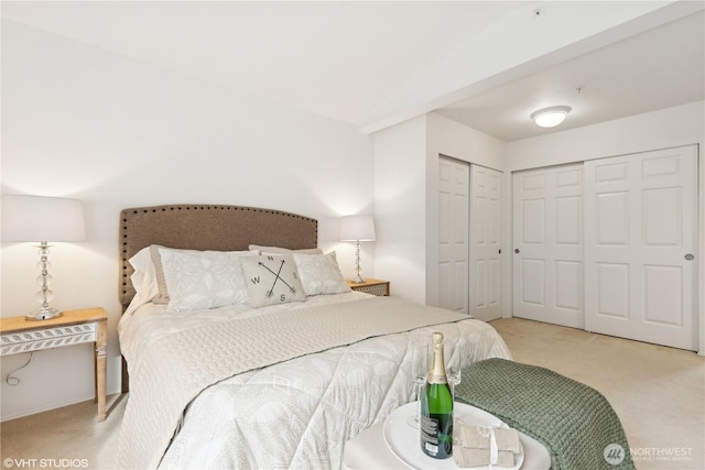 bedroom featuring light colored carpet