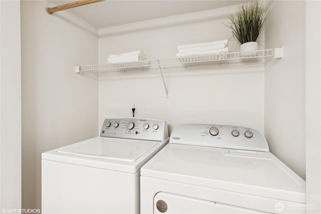 laundry room featuring separate washer and dryer