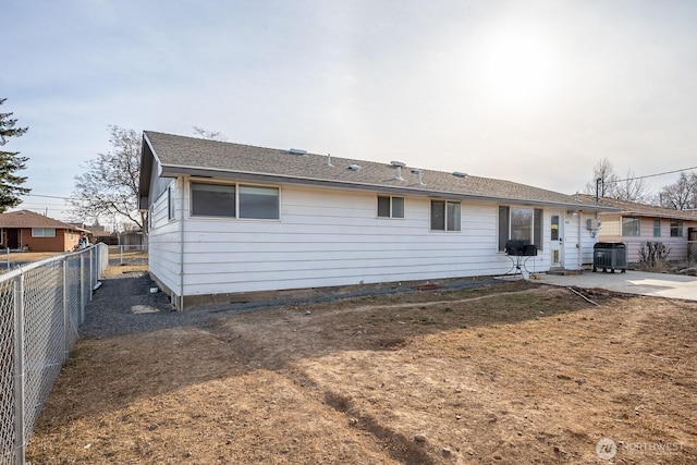 rear view of house featuring cooling unit and a patio area