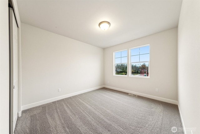 view of carpeted spare room