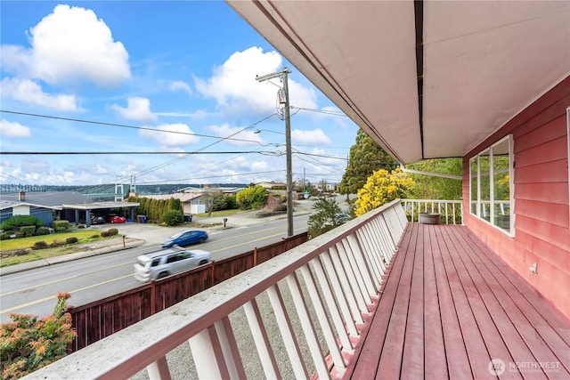 wooden deck featuring a residential view