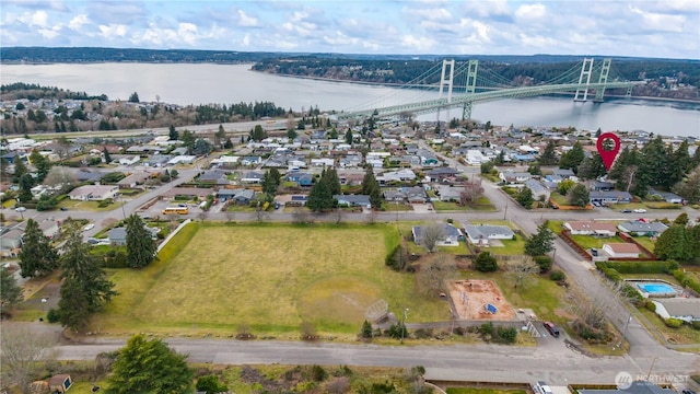 bird's eye view featuring a water view and a residential view