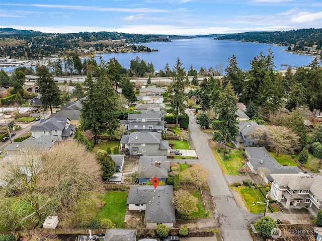 birds eye view of property with a residential view and a water view