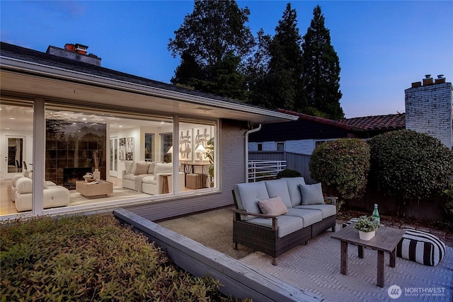 patio terrace at dusk with an outdoor living space