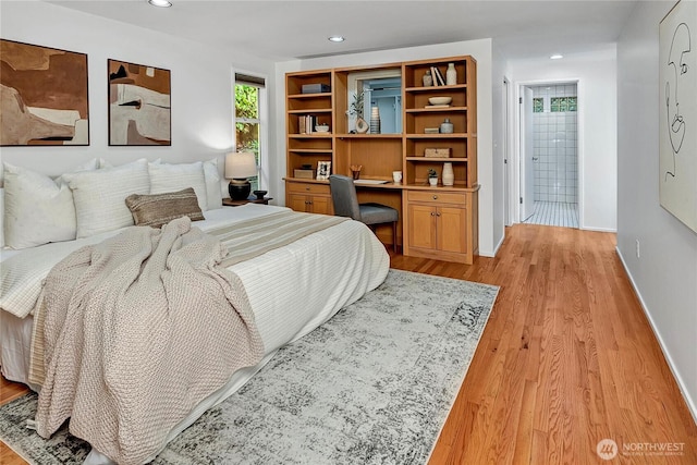 bedroom with light hardwood / wood-style flooring