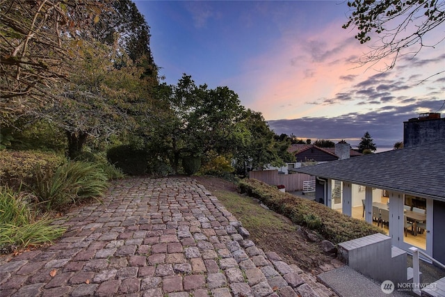 view of patio terrace at dusk