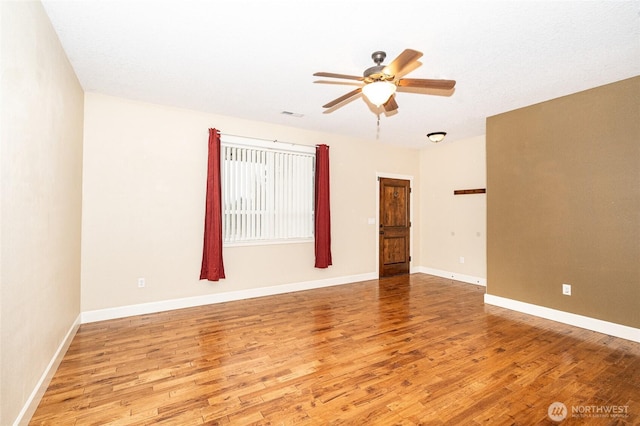 unfurnished room featuring ceiling fan and light wood-type flooring