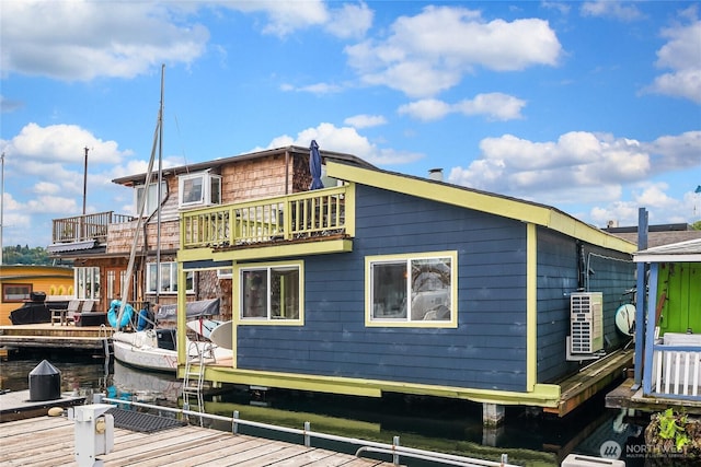rear view of property with a water view