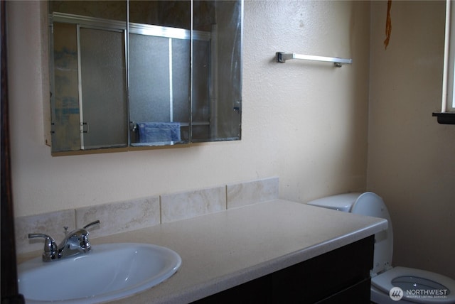 bathroom with vanity and toilet