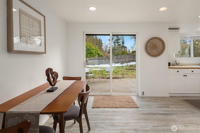 dining area with light wood-type flooring