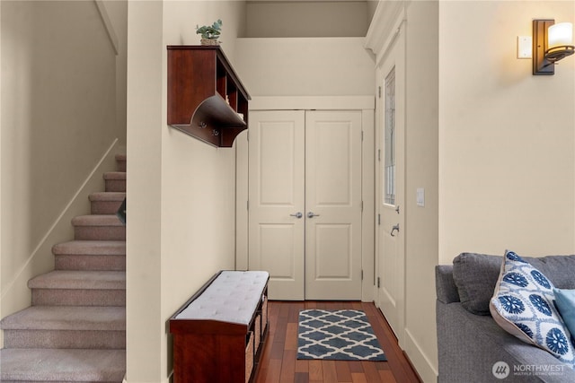 interior space featuring stairway and dark wood-style flooring