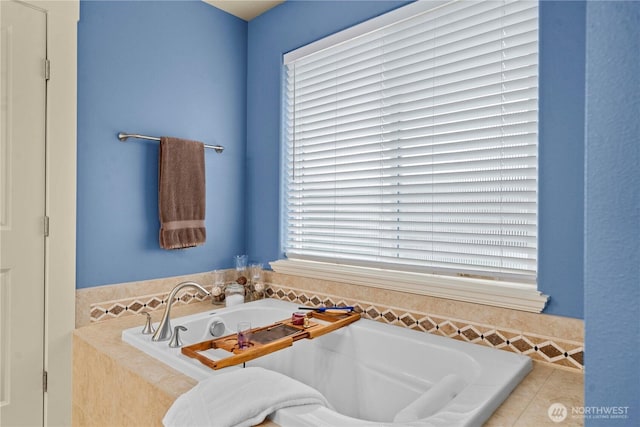 full bathroom with a garden tub and a wealth of natural light