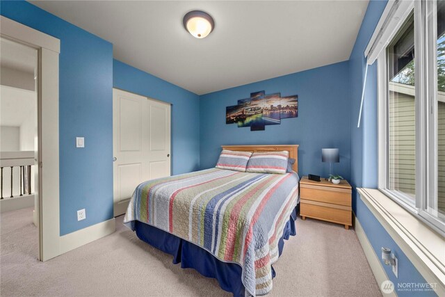 bedroom featuring baseboards and carpet floors