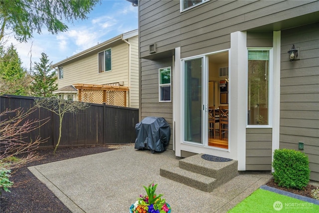 view of patio featuring fence and grilling area