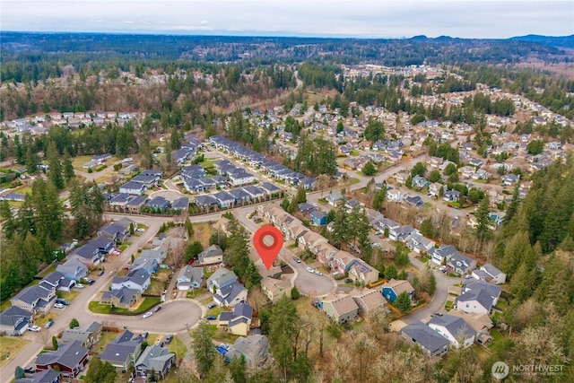 bird's eye view with a view of trees and a residential view