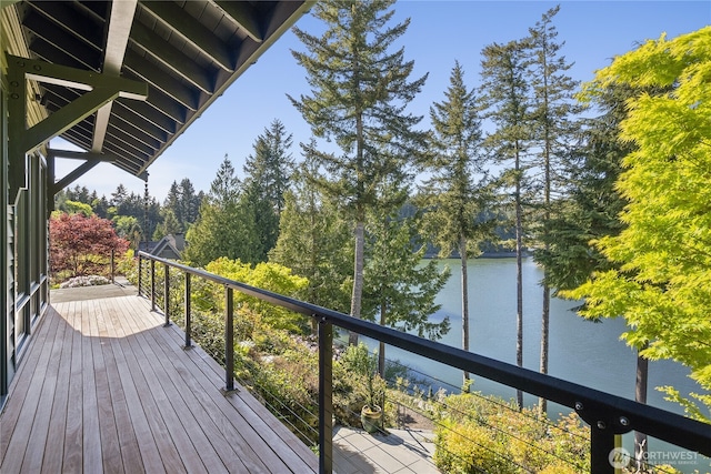 wooden deck featuring a water view