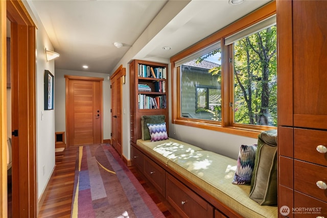 corridor featuring dark hardwood / wood-style floors