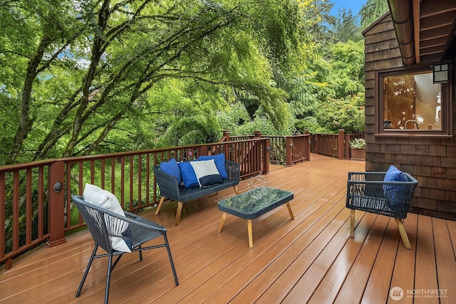 wooden deck with an outdoor hangout area