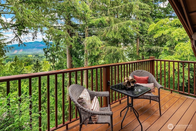 wooden deck featuring a mountain view