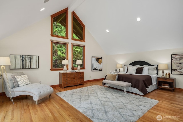 bedroom featuring beamed ceiling, wood-type flooring, and high vaulted ceiling