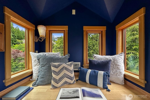 interior space featuring lofted ceiling and plenty of natural light