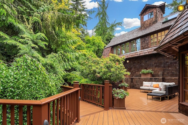 wooden deck featuring outdoor lounge area